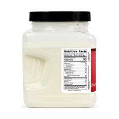 Hoosier Hill Farm Buttermilk Powder being poured into a measuring cup