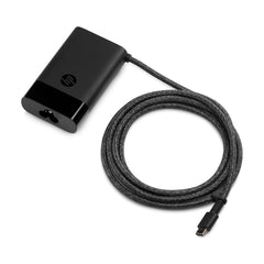 HP 65W USB-C charger side profile showing slim, travel-ready form.