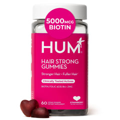 HUM Hair Strong gummies bottle on counter for daily nourishment