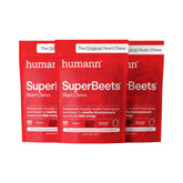 Humann SuperBeets Heart Chews bottle pouring for on-the-go energy support
