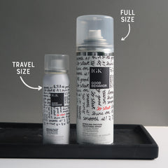 IGK GOOD BEHAVIOR travel-size bottle highlights on-the-go smoothing and heat protection.