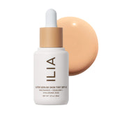 ILIA super-serum-skin-tint-spf40 bottle close-up with dewy finish and protection