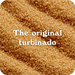 Pouring turbinado sugar into a coffee mug to enrich flavor.