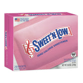 IN THE RAW Sweet'N Low coffee packets beside a cup for calorie-free sweetness.