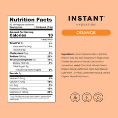 Instant Hydration orange drink mix dissolving in water for a bright flavor.