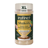 Instinct RawBoost Shakers bottle closeup highlighting cage-free chicken flavor.