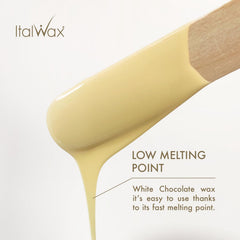 Italwax beads being applied with spatula for even direction free spreading