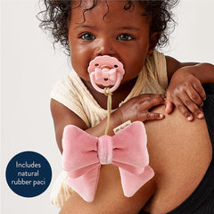 Itzy Ritzy Bitzy Pal lovey attached to pacifier for easy handling.