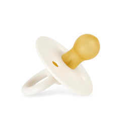 Itzy Ritzy 2-pack pacifier set in coordinating Coconut and Toast colors.