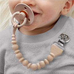 Itzy Ritzy one-piece design pacifier clip simplifies cleaning and prevents snagging on fabrics