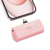 iWALK compact 4500mAh power bank powering iPhone on the go