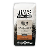 Jim's Organic Coffee Hazelnut bag front highlights aromatic hazelnut flavor for a comforting morning routine.