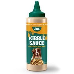Jinx Kibble Sauce bottle pouring over dog food to boost flavor
