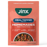 Jinx salmon chunks in bone broth as a savory wet-dog-food topper.