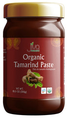 Jiva Organics Tamarind Paste bottle showing rich amber puree for sauces.