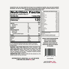Close-up of Jocko Fuel whey powder on desk showing premium blend