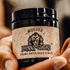 Johnny Slicks pomade with a high shine finish for sleek styles.