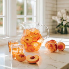 Pouring Jordan's Skinny Mixes Peach Tea Syrup into a drink for flavor.