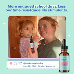 JoySpring Berry Lemonade bottle on glass emphasizes appealing flavor for kids.