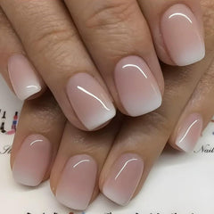 Juggssa short square nails with French ombre for salon-like elegance.