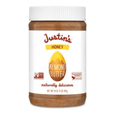 Justin's Honey Almond Butter 16-ounce jar on the counter, snack-ready.
