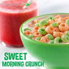 Kellogg's Apple Jacks spoon-dip close-up of crunchy loops.