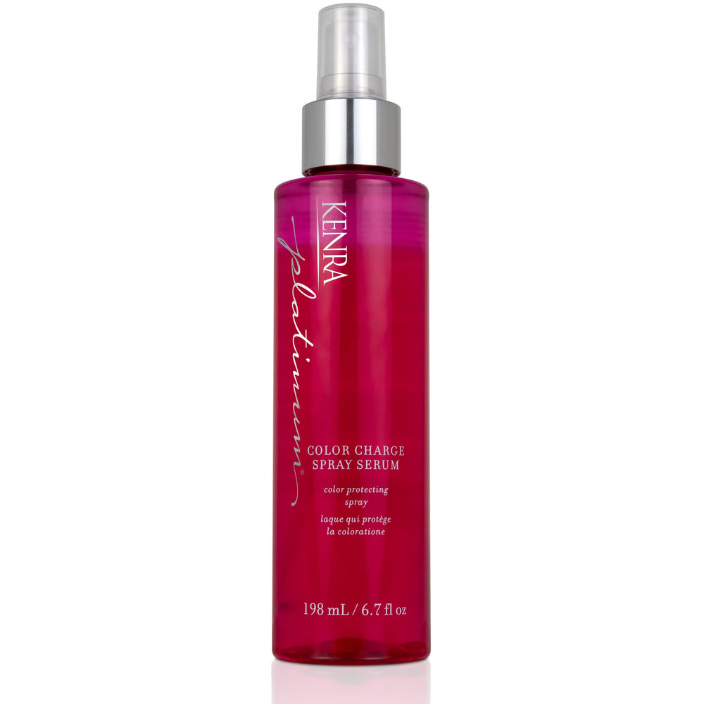 Kenra Platinum Color Charge Spray Serum bottle on vanity for color protection and shine.