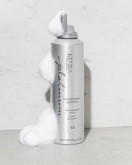 Kenra Platinum Thickening Mousse on damp hair ready for styling.