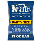 Kettle Brand Sea Salt & Vinegar bag on table, perfect party snack.