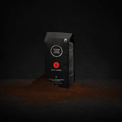 Steaming cup of Kicking Horse Happy Camper with inviting aroma.