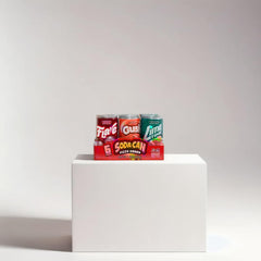 Kidsmania mini soda candy cans display grape, orange, lime, cola flavors.