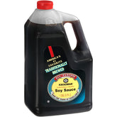 Kikkoman Traditionally Brewed Soy Sauce bottle on a table enhances home cooking with authentic umami.