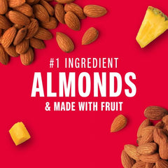 KIND Mango Pineapple Nut bar nuts closeup showing crunchy texture and natural ingredients.