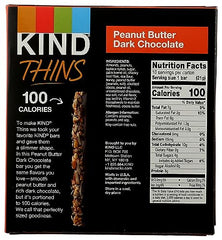 Kind Thins bar cross-section shows sliced cashews with chocolate.