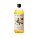 Koala Eco dish soap bottle pour showing lemon myrtle formula for grease-cutting cleaning.