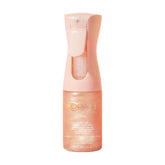 Kopari Rose Gold Sunglaze bottle spray highlights SPF 42 protection and a radiant finish.