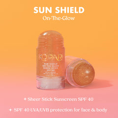 Kopari Sun Shield On-The-Glow stick gliding on skin for easy reapplication