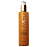 KORA Organics Turmeric Glow Foaming Cleanser bottle highlights organic formula for radiant skin.