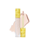 Kosas Revealer Concealer bottle close-up shows creamy texture for easy application.
