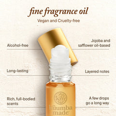 Kuumba Made Amber & Sandalwood ingredients with jojoba and safflower for skin-friendly use.