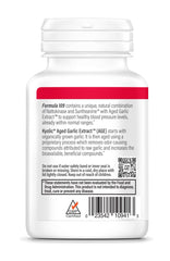 Person holding Kyolic Formula 109 capsules for simple daily dosing routine