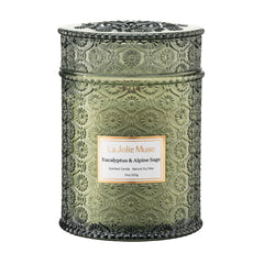 LA JOLIE MUSE eucalyptus-alpine-sage candle in a daisy-embossed jar adds elegant ambiance