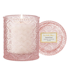 LA JOLIE MUSE Santal Rose candle jar with daisy embossing enhances decor and ambiance.