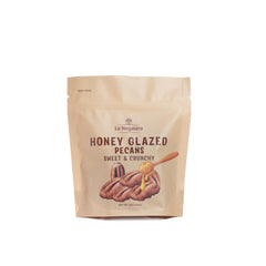 La Nogalera honey glazed pecans in a 5oz pouch for on-the-go snacking.