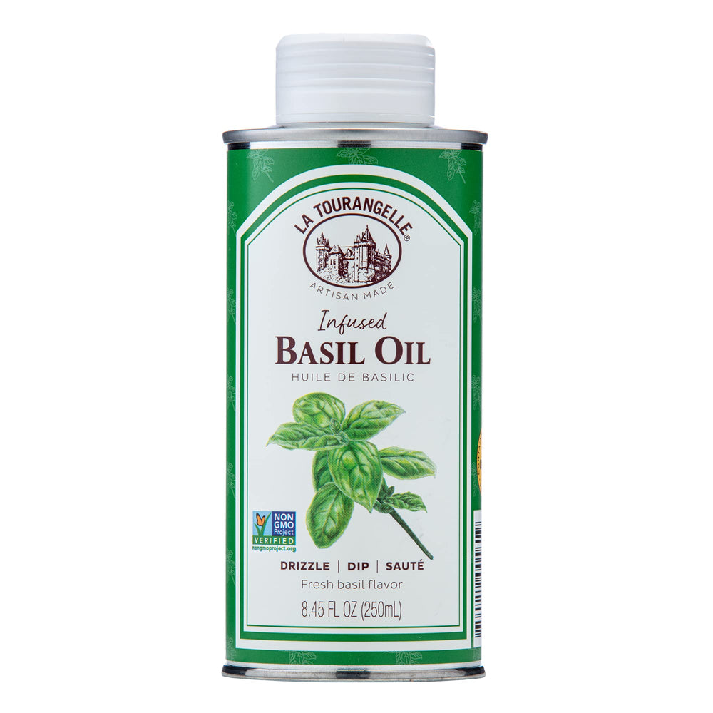 La Tourangelle Basil Infused Oil bottle pouring to finish a fresh salad.