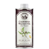 La Tourangelle Roasted Walnut Oil bottle pouring, adds nutty depth to dishes.