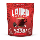 Laird Superfood Peppermint Mocha creamer powder being poured into hot coffee for a creamy minty boost