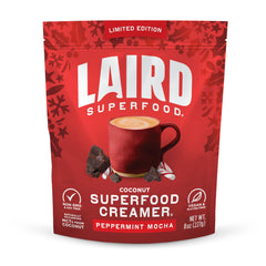 Laird Superfood Peppermint Mocha creamer powder being poured into hot coffee for a creamy minty boost