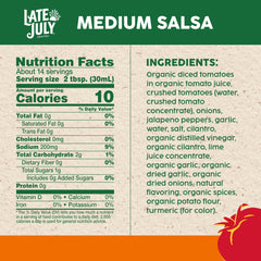 Late July salsa with tortilla chips on a platter, ideal for parties.