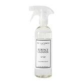 The Laundress Surface Cleaner No. 247 bottle pour enabling controlled, streak-free cleaning.